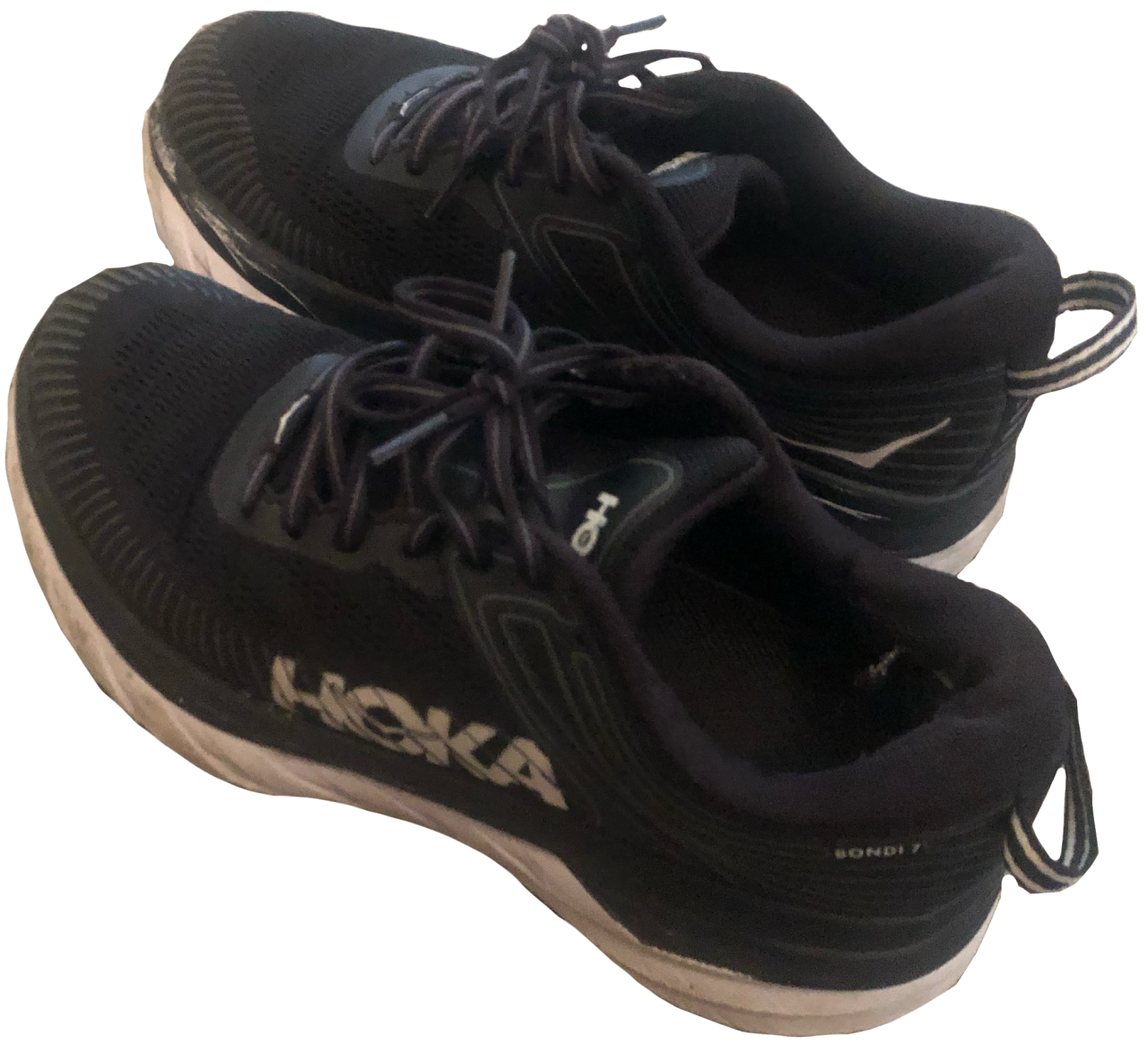 A pair of black and white shoes from Hoka